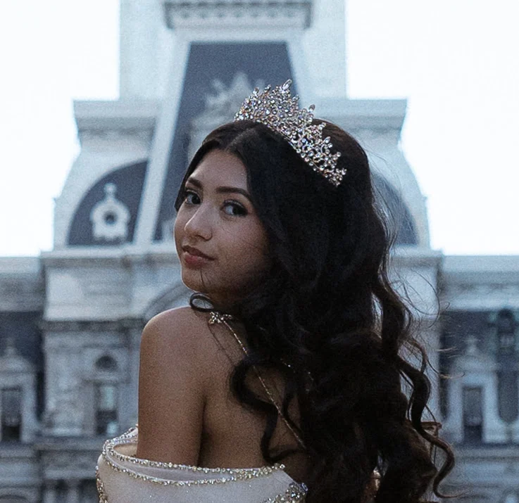 Celeste looking over her shoulder, wearing her tiara.