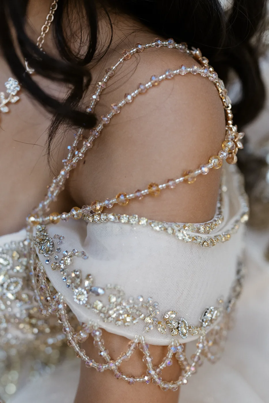 Detail of the jeweled sleeve of Celeste’s gown.
